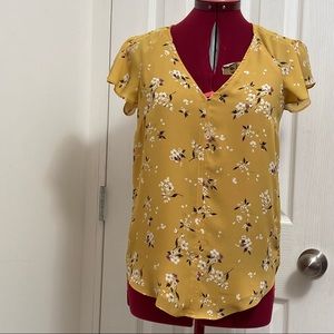 H&M women  mustard yellow floral short sleeves pullover top. Size 0.  Used.